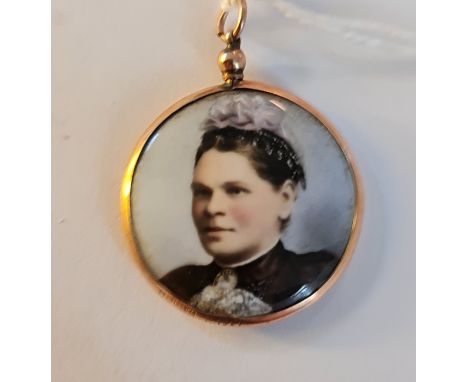 A very small 19th century portrait miniature on ivory of a lady with black hair in black dress in 9ct gold circular frame. Th