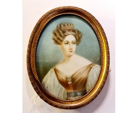 A 19th century portrait miniature on ivory of a lady with tiara and jewelled dress signed Stieler with writing to back naming