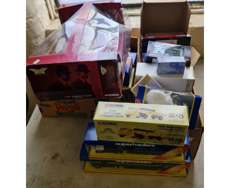 A collection of Corgi boxed tracks cars and the Wright Brothers Flyer.