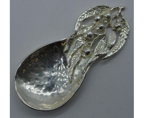 Australian silver tea caddy spoon embossed gumnut and leaf decoration. L10cms approx W45grams approx.