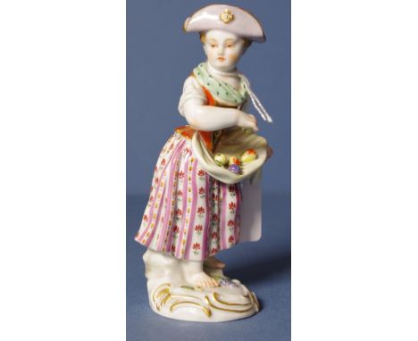 Antique Meissen young girl figure hand painted girl with her apron containing fruit. Cobalt blue mark to base. H14cms approx.