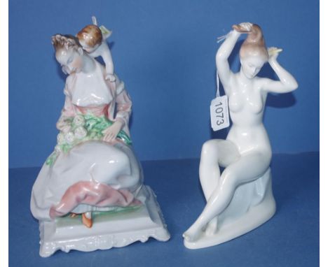 Two various Hungarian ceramic figures including Herend seated woman with cupid; & Aquincum seated nude. H24cms & 23cms approx
