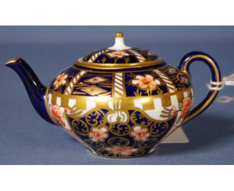 Early Royal Crown Derby miniature teapot handpainted imari pattern decoration. Marked  # 6299 to base. H5cms approx.