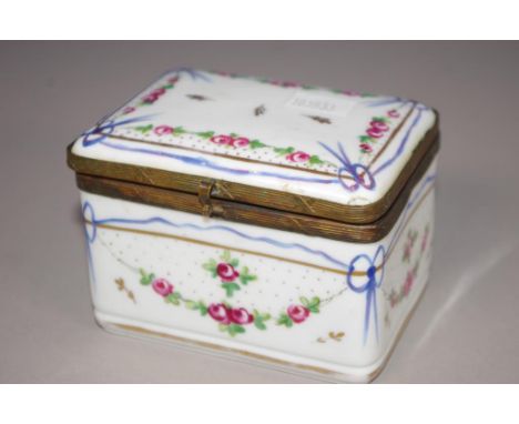 Continental porcelain lidded trinket box hand painted floral decoration. Brass rims to lid and base. Marked Josephine to base