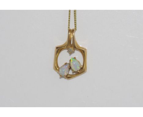 Yellow gold, opal and diamond pendant marked 14K, weight: approx 3 grams, size: approx 2.3 cm including bale, on metal chain