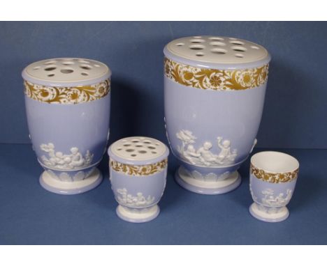 Four graduated Spode pot pouri vases All with embossed white figural decoration on blue ground, with gilded highlights to upp