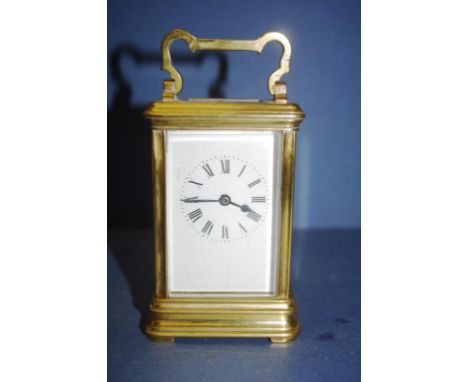 French brass cased carriage clock together with key, 15cm high approx