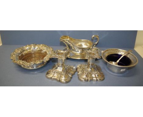 Five various silver plated table ware pieces including pair squat candlesticks; wood based wine bottle coaster; bowl with blu