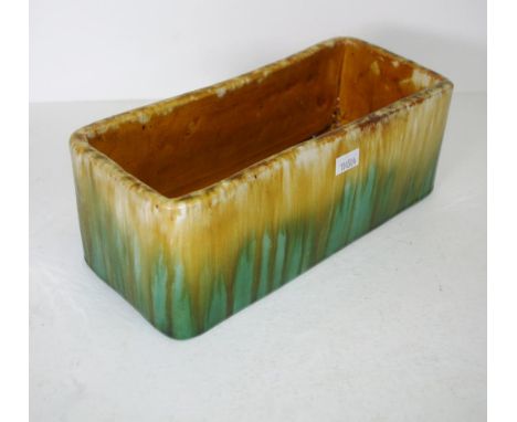 John Campbell trough vase green and yellow drip glaze, inscribed signature to base. L25cms approx.