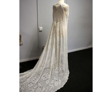 A long lace cloak, together with a silk blouse. 