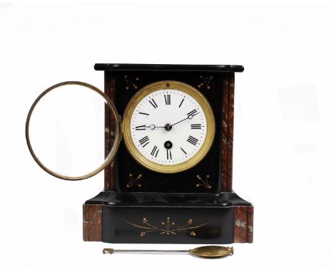 A French black slate mantle clock with red marble accents, white enamel face and roman numeral markers. 