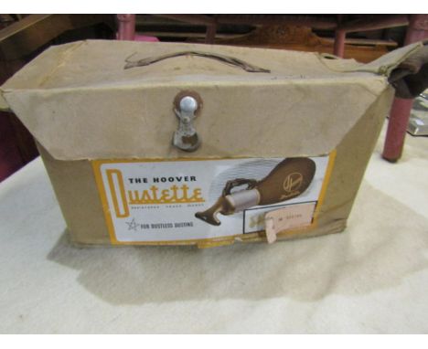 A 'Dustette' vintage vacuum cleaner in original box