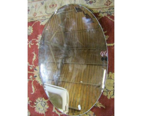 an oval vintage mirror