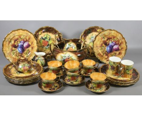 A collection of K & K china dinner and teawares decorated with fruit.