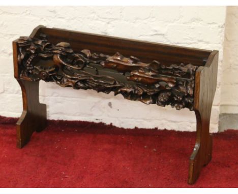 A carved oak plant trough.
