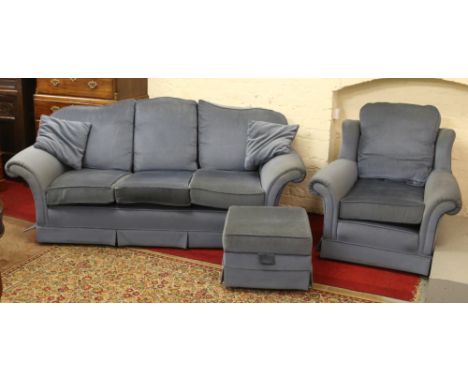 A blue draylon three seater sofa and matching armchair along with a footstool.