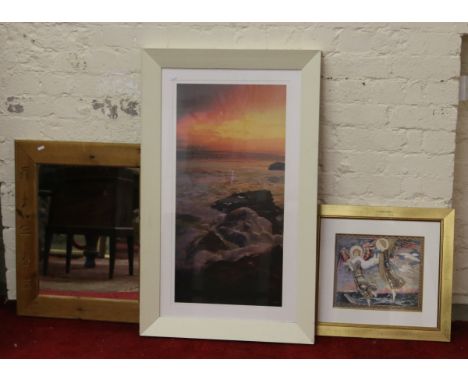 A large framed print sunset over a beach along with a pine framed wall mirror and gilt framed print.