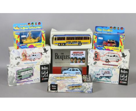 A collection of boxed Corgi diecast models of Beatles related cars, vans and buses along with The Yellow Submarine.