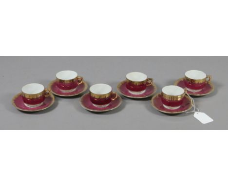 A set of childs continental porcelain cups and saucers.