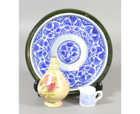 A Cauldon plate decorated after a Persian original, a Royal Worcester miniature jug and a Royal Worcester blush vase.