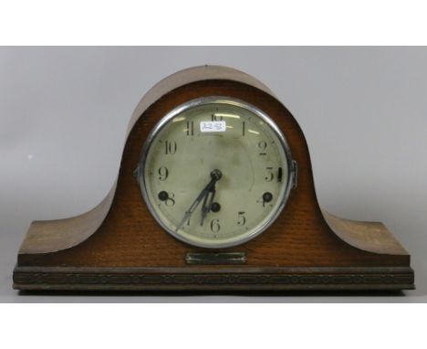 An oak cased Westminster chime mantel clock.