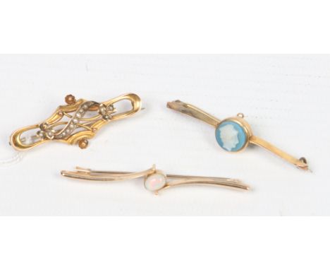 A ladies 9 carat gold and seed pearl bar brooch along with two other 9 carat gold bar brooches, one opal and the other cameo,