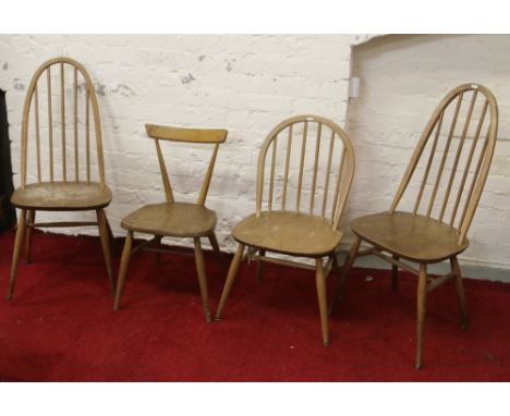 Four odd Ercol style light oak dining chairs.