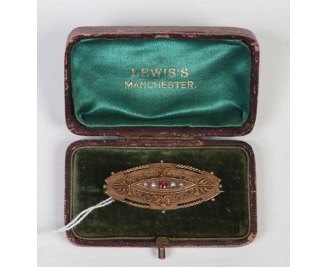 A Victorian 9 carat gold ruby and seed pearl brooch assayed Chester 1901, 5.18 grams.