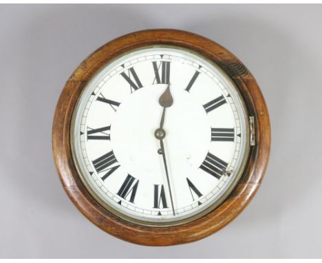 An oak and mahogany cased circular wall clock fusee movement and enamel face.
