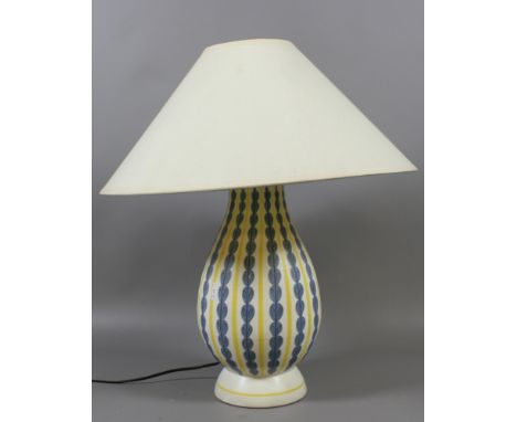 A large Poole pottery based tablelamp, the base with stylized decoration, AF. Condition Report. To be used as a guide only. B