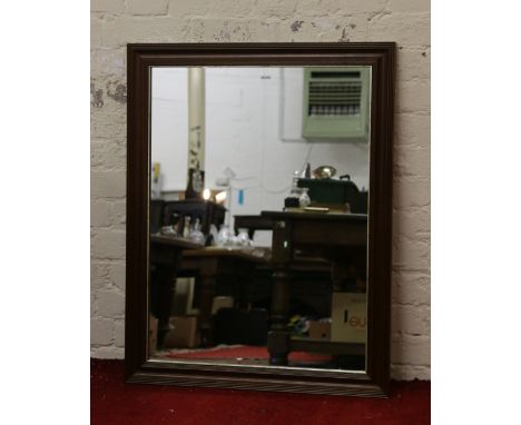 A large mahogany framed wall mirror.