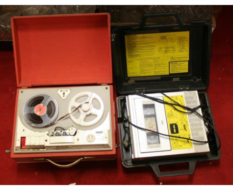 An old Robuk reel to reel tape recorder and cased VHS video recorder.
