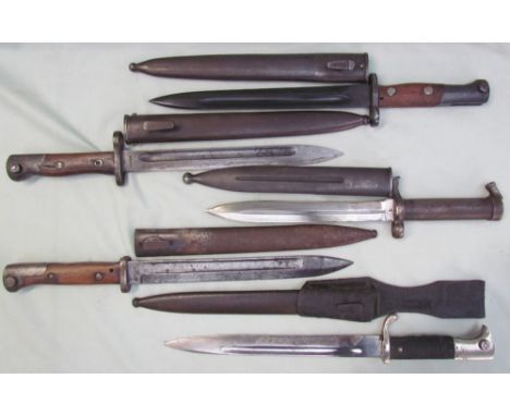 A World War II German bayonet, with a fullered blade stamped Paul Seilheimer, Solingen, with scabbard together with four othe