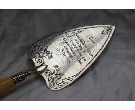 A Victorian silver trowel engravedwith scrolling leaves, inscribed "Presented to Jacob Chivers Esquire on his laying the memo