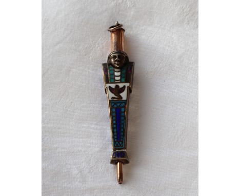 A novelty propelling pencil in the form of an Egyptian sarcophagus, in yellow and white metal with enamel decoration, 5cm, 10