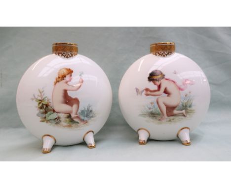 A pair of Mintons porcelain moon flasks painted with a boy chasing a butterfly, the other with a girls and a dandelion clock,