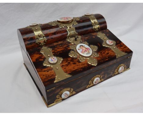A Victorian coramandle, brass bound and porcelain panel inset writing slope, by Trussell, Brighton, the domed hinged top encl
