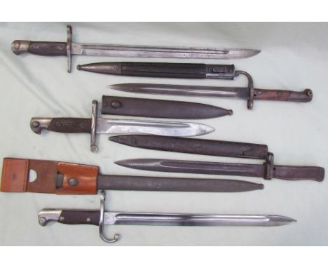 A bayonet, the blade marked "Modelo Argentino 1909", with scabbard, together with four other bayonets