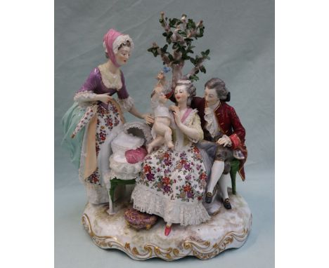 A 19th century Berlin porcelain figure group, depicting a family scene with a toddler, parents and grandparent, on a shaped o