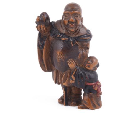 PARTLY LACQUERED WOOD NETSUKE OF A MAN AND BOY, CIRCA 1870 the man holding a cat on his upraised hand, unsigned 5.6cm high Pr