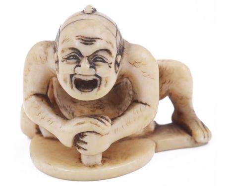 ˜IVORY NETSUKE OF A MIRROR POLISHER, CIRCA 1850 signed: Masayuki 3.2cm high Provenance: The Netsuke Collection of Charles Eph