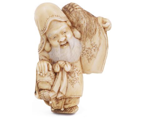 ˜STAINED IVORY NETSUKE OF THE LUCKY GOD JUROJIN WITH A MINOGAME, CIRCA 1870 all symbolic of longevity, the stain over the bea