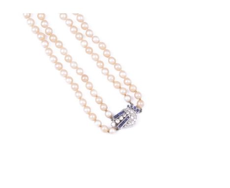 CULTURED PEARL, SAPPHIRE AND DIAMOND NECKLACE, 1950s the clasp of geometric design set throughout with brilliant- and single-