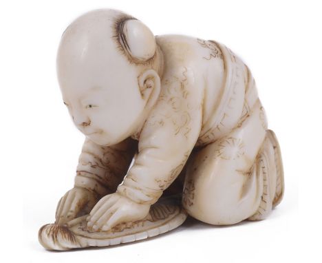 ˜LIGHTLY STAINED IVORY NETSUKE OF A BOY CRUSHING A BUTTERFLY WITH A FAN, CIRCA 1870 signed: Tomochika 2.8cm high Provenance: 