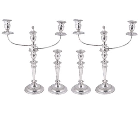 A SUITE OF FOUR GEORGE III SILVER CANDLESTICKS AND A PAIR OF CANDELABRA BRANCHES, WILLIAM TUCKER &amp; CO., SHEFFIELD, 1807 w