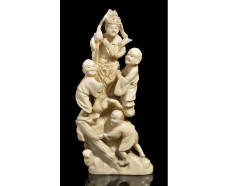 ˜A JAPANESE IVORY OKIMONO OF A MAN AND BOYS WITH BAMBOO LADDER, MEIJI PERIOD (1868-1912) carved with the man holding the ladd