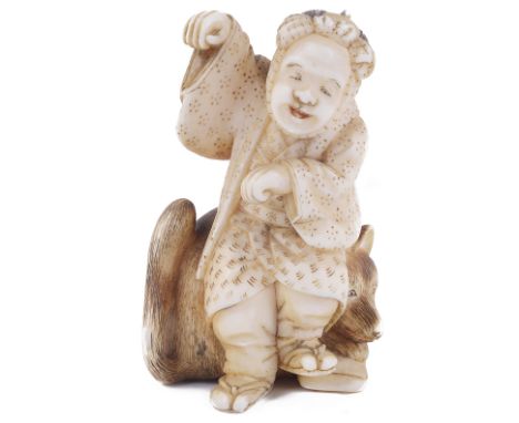 ˜IVORY NETSUKE OF A MAN DANCING WITH A FOX, CIRCA 1870 incised and stained details, signed: Tomonobu 4.6cm high Provenance: T