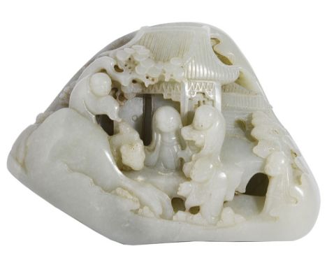 A CHINESE CELADON JADE BOULDER deeply carved to the front face with boys outside a pavilion, the reverse with a fenced mounta