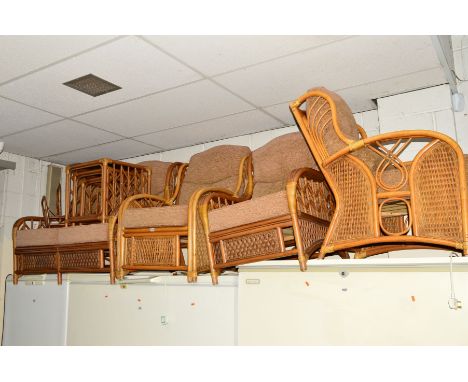 A CONSERVATORY SUITE comprising of a two seater sofa, three chairs, a nest of three tables and a magazine rack (6)