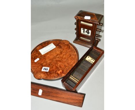 AN EDWARDIAN OAK PERPETUAL CALENDAR, a John Makepeace circular burr elm and burr Chestnut circular tray, a boxed set of bone 